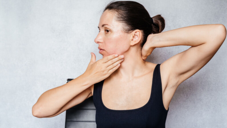Woman demonstrating exercise for the neck
